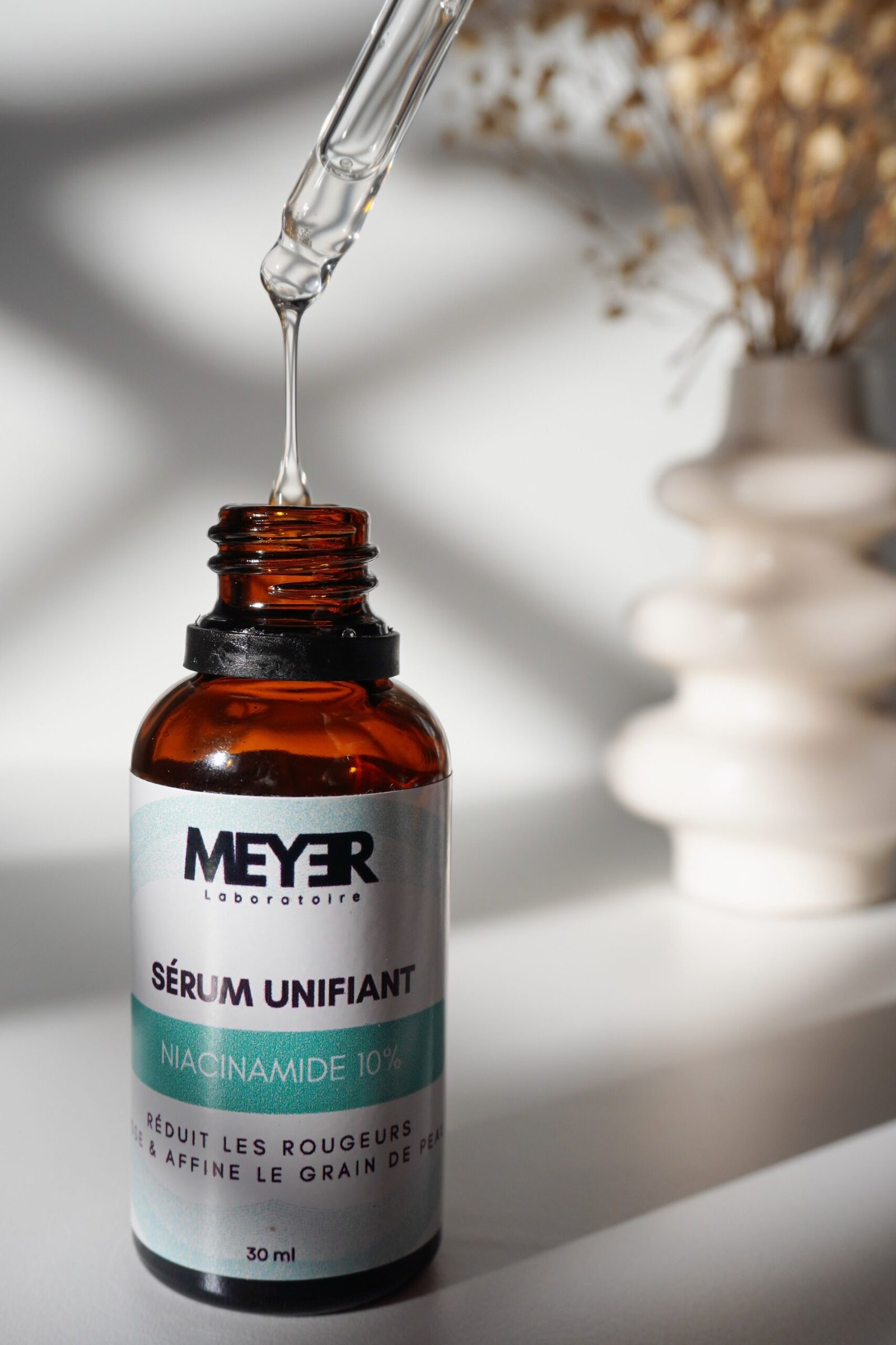 Niacinamide serum bottle with dropper