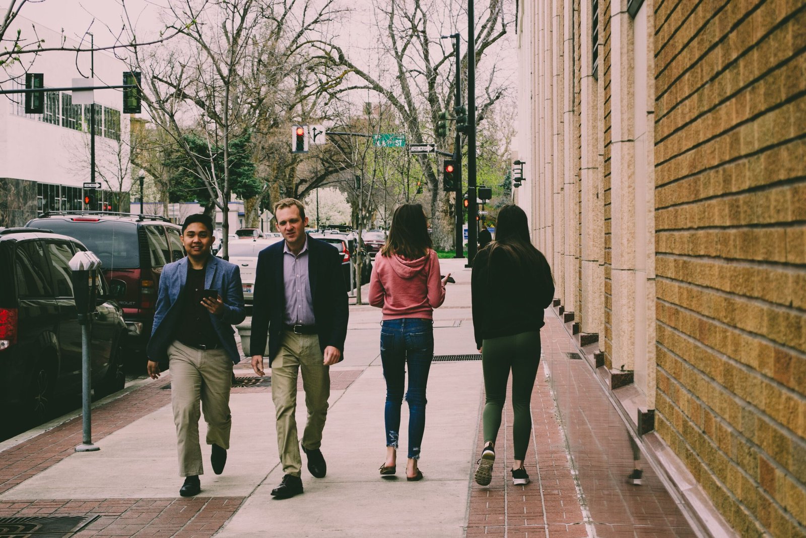 People walking on a city sidewalk during the day, illustrating an active daily walking habit