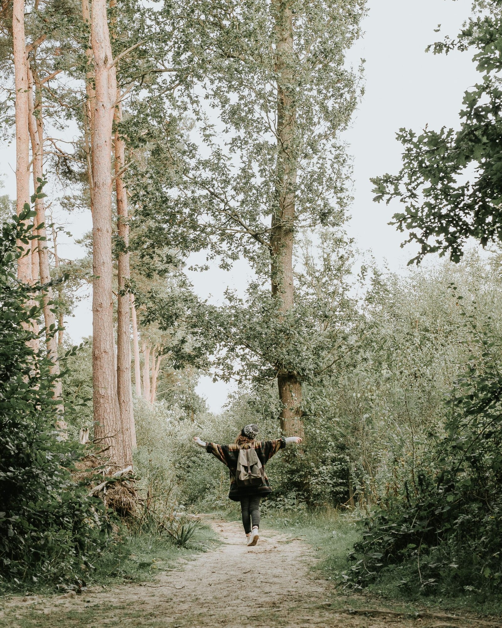 Person standing strong and calm outdoors, representing emotional resilience through life's challenges