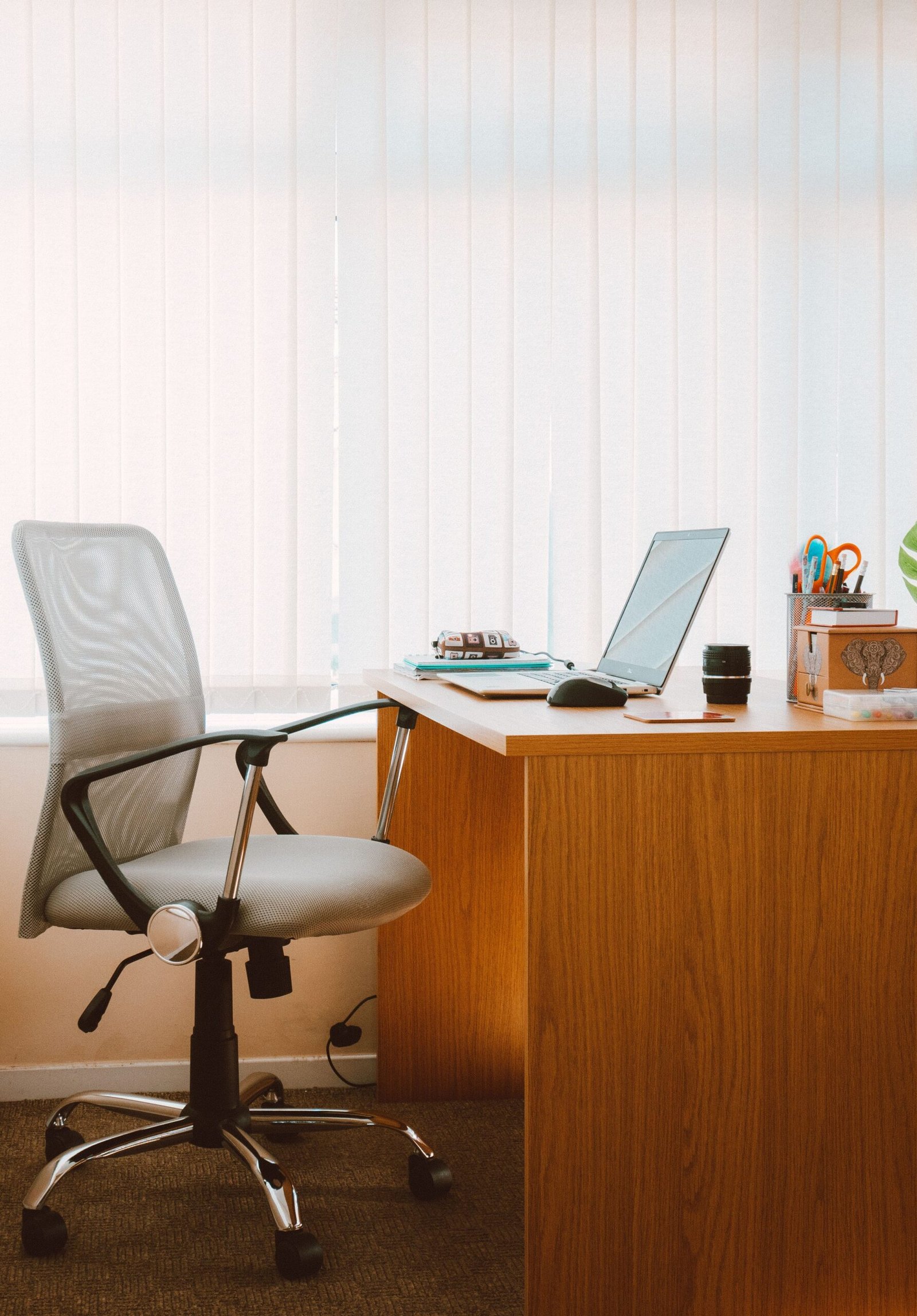 Ergonomic office chair and desk setup, supporting healthy posture while working