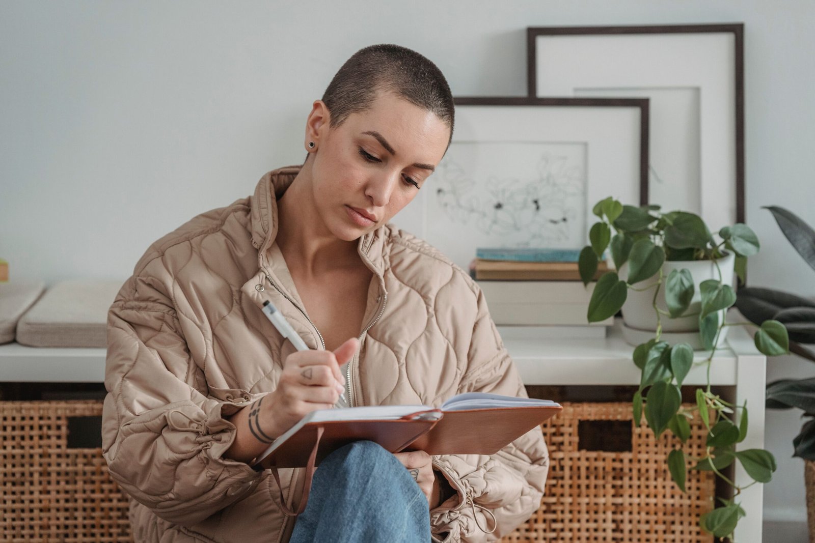 Woman journaling to calm her mind and stop overthinking